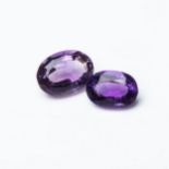 A PAIR OF UNMOUNTED OVAL-CUT AMETHYSTS