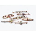 A MISCELLANEOUS COLLECTION OF SEVEN GEM-SET BAR BROOCHES