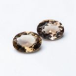 A PAIR OF UNMOUNTED OVAL-CUT SMOKY QUARTZ