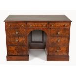 A GEORGE III WALNUT AND INLAID KNEEHOLE DESK