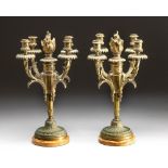 A PAIR OF GILT-METAL FOUR-LIGHT CANDELABRA