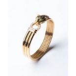 A GOLD CARTIER-STYLE LEOPARD BANGLE Pavé-set to the side with 0,40 carats of round brilliant-cut