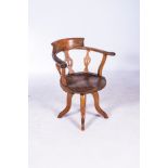 AN OAK CAPTAIN'S CHAIR, LATE 19TH CENTURY The rounded back with scroll cresting, three vase shaped
