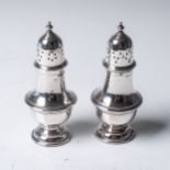 PAIR OF VASE-SHAPED SILVER PEPPERETTES S Blanckensee & Son, Birmingham 1906, with moulded girdles,