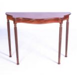 A GEORGE III-STYLE MAHOGANY CONSOLE TABLE, 20TH CENTURY With shaped bow front top above a conforming