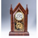 A WOODEN MANTEL CLOCK The 16cm circular dial with Roman numeral hour markers, calibrated outer ring,