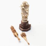 AN INDIAN IVORY CARVING OF KRISHNA  The bejeweled figure standing on a lotus playing the flute;