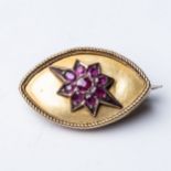 A RUBY BROOCH Claw-set to the center with 9 rubies in a star design, with a combined weight of