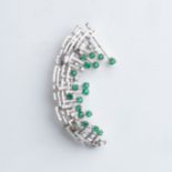 AN EMERALD AND DIAMOND BROOCH Claw-set with round brilliant- and baguette-cut diamonds weighing