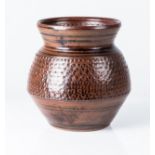 ESIAS BOSCH (SOUTH AFRICAN 1923 - 2010): A STONEWARE POT With iron glaze over incised decoration
