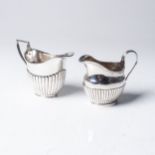 TWO SILVER CREAM JUGS  The first Dobson & Dobson, London 1881, the oval body half-lobed; and a