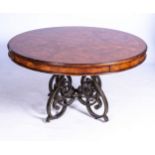 AN OAK VENEERED CENTRE TABLE The circular top with veneered panels within a chequered band, the