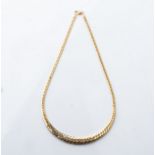 A GOLD CHAIN Tapered herringbone design in 9ct gold, 45cm in length