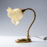 A BRASS TABLE LAMP The oval base with egg and egg-and-dart borders rising to an adjustable S-