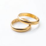 A PAIR OF MATCHING WEDDING BANDS The half rounded bands 4mm in withd, hallmarked 900, size K (2)