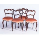 A SET OF FOUR VICTORIAN PINK FRUITWOOD DINING CHAIRS With moulded hoop backs with shaped crossbars