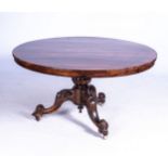 A COROMANDEL AND OAK TILT-TOP DINING TABLE, MID 19TH CENTURY The circular coromandel top on a