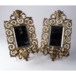 A PAIR OF GILT METAL MIRRORED THREE-LIGHT WALL SCONCES, LATE 19TH/EARLY 20TH CENTURY 45cm long,