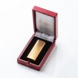 A GOLD-PLATED CARTIER LIGHTER Accompanied by original box and papers, 6,8cm high