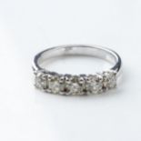 A DIAMOND ETERNITY RING 0,60 CARATS Claw-set with 5 round brilliant-cut diamonds, colour IJ, clarity