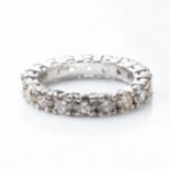 A FULL DIAMOND ETERNITY RING 3,50 CARATS Round brilliant-cut claw-set diamonds, colour light cognac,