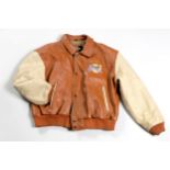 A VINTAGE PLANET HOLLYWOOD JACKET Cinnamon and tan coloured leather in a bomber jacket style From