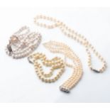 A COLLECTION OF PEARL NECKLACES various styles and lengths with silver clasps (4)