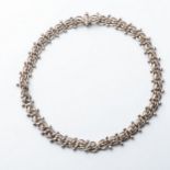 A SILVER CHAIN The plaited link chain 15mm wide, with cross over design, with screw in clasp, 50cm