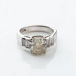 A DIAMOND RING 4,27 CARATS Claw-set to the center with a radiant-cut diamond, accompanied by an