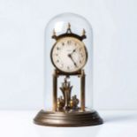 A BRASS MANTEL CLOCK