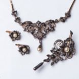 A PART SUITE OF PEARL AND DIAMOND JEWELLERY, c.1900 Comprising: a pendant, a pair of earrings and