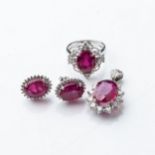 A SUITE OF RUBY AND DIAMOND JEWELLERY Comprising: a ring, a pair of earrings and a pendant, set with