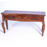 A STAINED PINE SIDE TABLE, 20TH CENTURY The rectangular paneled top above three frieze drawers, on