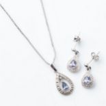 A SUITE OF TANZANITE JEWELLERY Comprising: a pendant and pair of earrings set in 9ct white gold (2)