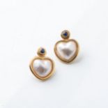 A PAIR OF MABÉ PEARL EARRINGS Bezel-set with a pair of heart-shaped mabé pearls beneath a pair