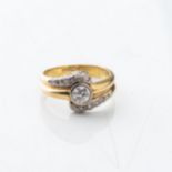 A DIAMOND DRESS RING Bezel-set to the center with a round brilliant-cut diamond weighing