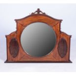 A MAHOGANY OVERMANTEL MIRROR, EARLY 20TH CENTURY The arched cresting above a circular mirror plate