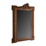 A CARVED WALL MIRROR, 18TH/19TH CENTURY With pierced rocaille cresting above carved rectangular