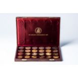 A 50TH ANNIVERSARY MEDALION SET 24 one ounce sterling silver gold-plated coins, accompanied by the