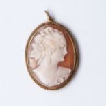 A CAMEO PENDANT Bezel-set with a twisted wire frame, in 9ct gold