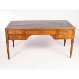 A MAHOGANY WRITING TABLE, LATE 19TH CENTURY The French base with gilt-metal mounts fitted with