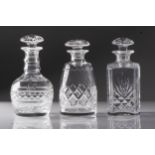 A PAIR OF STUART CRYSTAL DECANTERS and another decanter The taller 23cm high (3)