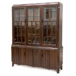AN IMBUIA CABINET, MID 20TH CENTURY In two parts, the moulded rectangular cornice above a cottage-