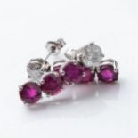 A PAIR OF RUBY AND DIAMOND EARRINGS Claw-set with 6 round brilliant-cut rubies with a combined