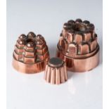 A COLLECTION OF COPPER JELLY MOULDS The larger 11cm (3)