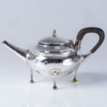 AN ARTS & CRAFTS SILVER TEAPOT  A Edward Jones, Birmingham 1906, the compressed spherical body with