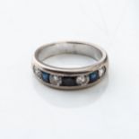 A SAPPHIRE AND DIAMOND ETERNITY RING Chanel-set with 3 sapphires weighing 0,66 carats and 3 diamonds