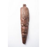 AN AFRICAN WOODEN MASK 70cm high, 22cm wide