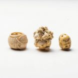 A JAPANESE IVORY 'ZODIAC BALL' NETSUKE Carved as a cluster of heads representing zodiac animals;
