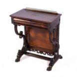 A ROSEWOOD OCCASIONAL TABLE The rectangular top with pierced brass gallery, frieze drawer, moulded